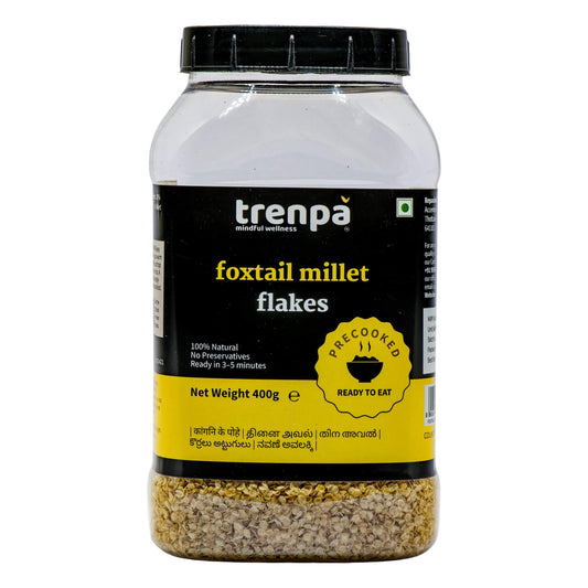 Jar of trenpa foxtail millet flakes on a white background