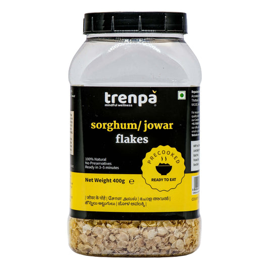 Jar of trenpa sorghum/jowar flakes on a white background